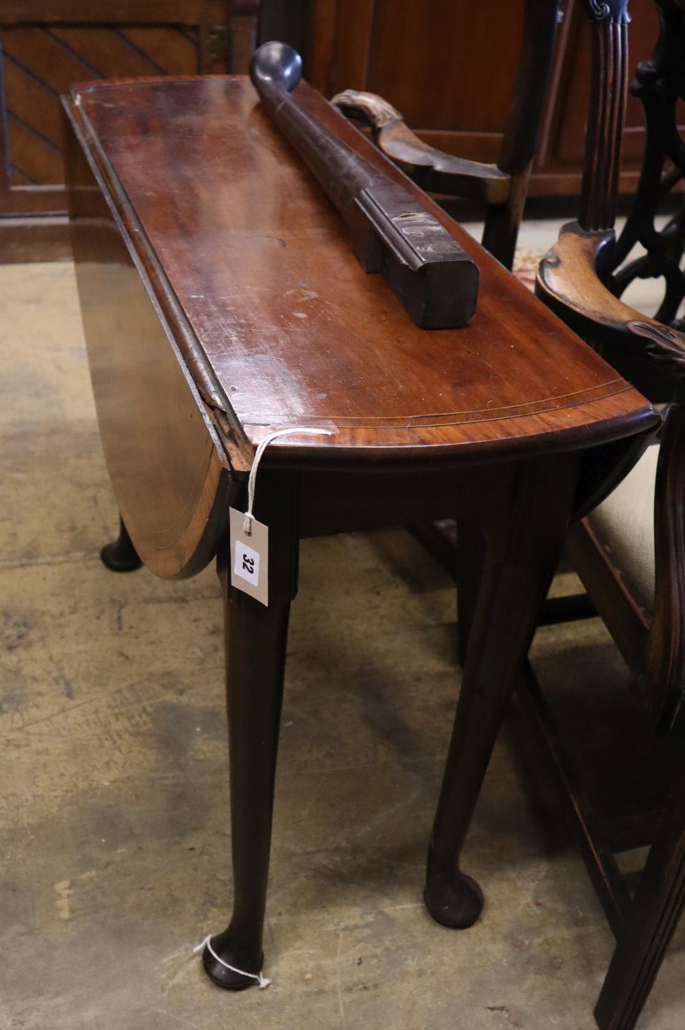 A George III crossbanded mahogany pad foot dining table, width 94cm 90cm (extended) height 70cm
